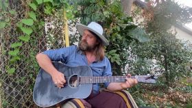Justin Holmes playing guitar